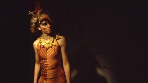 A photo of an actor in The Juniper Tree, an early immersive theatre piece by Common Wealth.