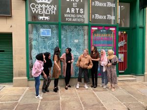 a photograph of the speakers corner women and girls outside the original political social space in Bradford City Centre.