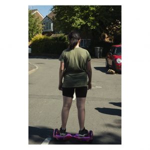 The back of a child on a hover board