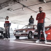 Photo of the main cast of Peacophobia, an immersive theatre piece about Islamophobia and modified cars.