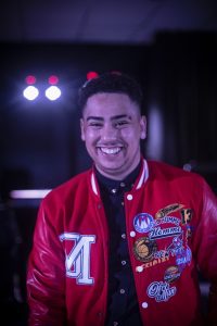 Man in red jacket smiling