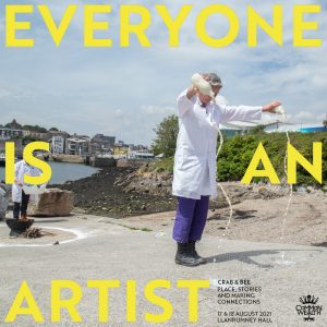 A woman holds her arms up and pours milk on to the ground. The words "Everyone is an Artist" in yellow are on top of the image