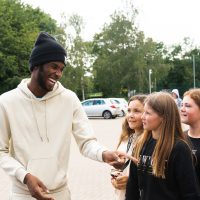 grime artist speaking to participants 