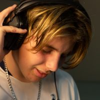 young boy wearing headphones