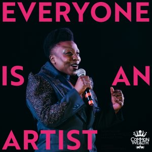 The words "Everyone Is An Artist" are laid on top of an image of a black person with short hair, wearing a blue sparkly suit, singing into a microphone