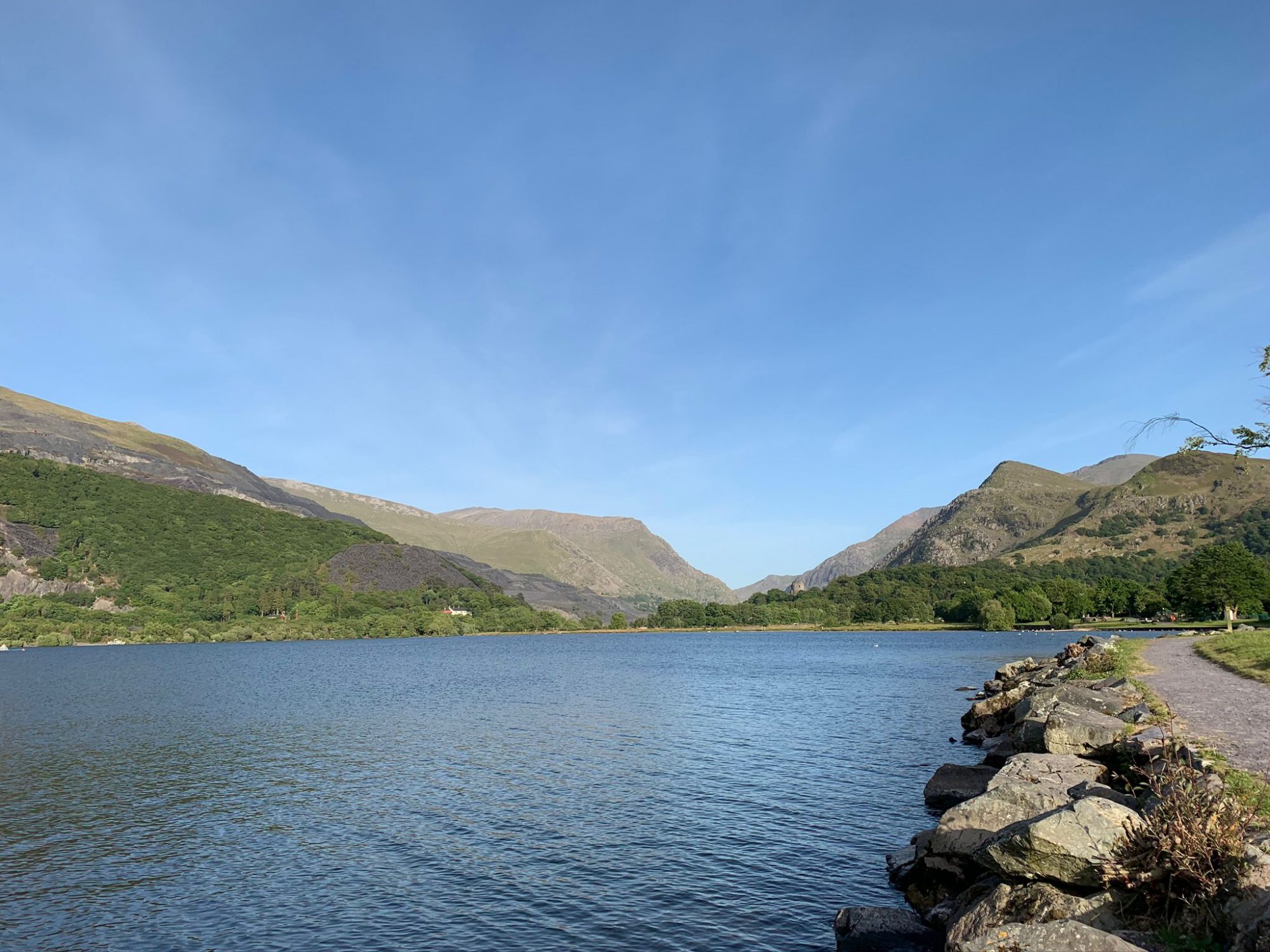 A photograph of a lake surrounded by mountains