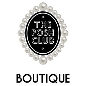 The words "Posh Club" on a black and white badge, edged with pearls with the word "Boutique" below