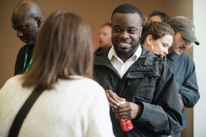 Audience members deep in discussion at launch event.