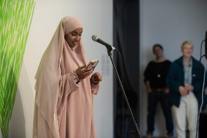 Poet reading at Grenfell: We Stand With You Event.
