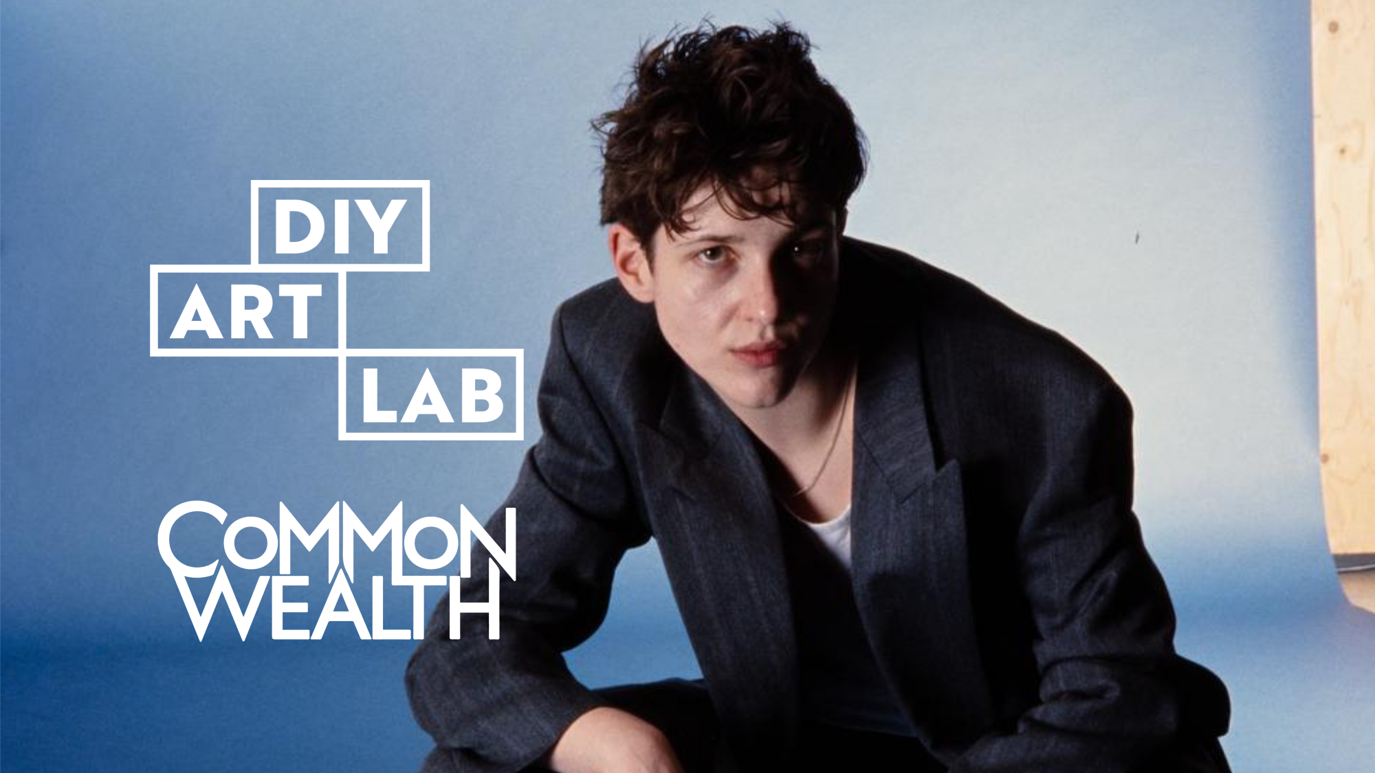 Performer Liv Ello in front of a plain blue background. The text reads Common/Wealth and DIY ART LAB